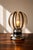A touch of exceptional rarity introduces this stunning and imposing space age mid century modern table lamp attributed to...