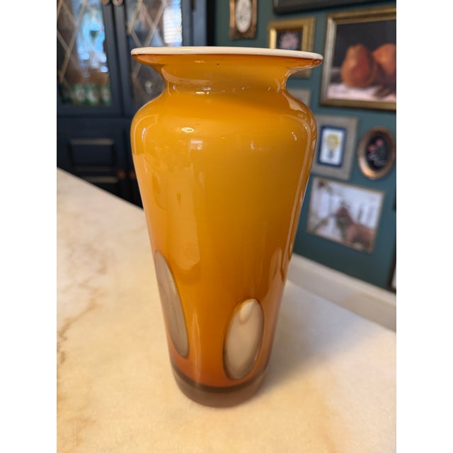 Elevate your mid-century modern collection with this stunning, hand-blown cased art glass vase. Featuring a striking...
