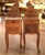 Graceful proportions and charming Rococo details give this elegant pair of antique bedside tables exceptional French...