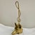 The Virginia Metalcrafters Brass Fox & Whip Door Stop is a vintage decorative accessory designed with a charming fox...