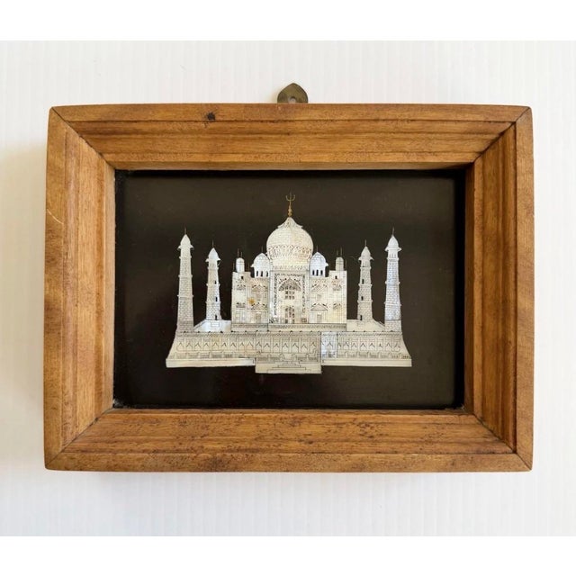 Intricately carved and painted mosaic in handmade wood frame.