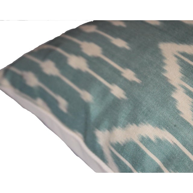 Bohemian silk ikat pillow with vibrant colors of red, beige and blue. Super hand soft. Pillow has a zipper for closure....