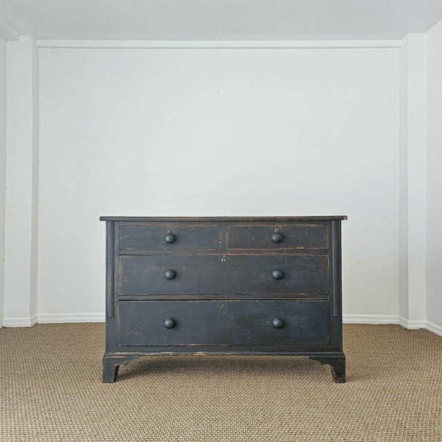 Dimensions: 54.25"W x 21"D x 36.25"H A beautifully timeworn English pine chest, finished in a rich ebonized and waxed...