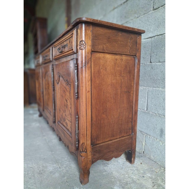 Superb low Bressan sideboard, inspired by Louis XV style, characterized by its snail-shaped legs. The panels of the three...