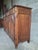 Superb low Bressan sideboard, inspired by Louis XV style, characterized by its snail-shaped legs. The panels of the three...