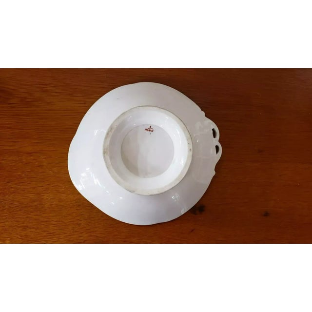 This is a Late 19th Century Old Paris Porcelain Floral Motif Cake Stand. It measures 2" high x 9 x 9 7/8". The piece is in...