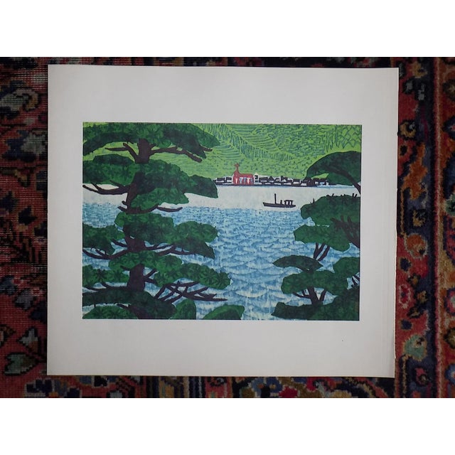 This pair of vintage mid 20th century lithographs depict Japanese landscape/marine scenes. They were published in Japan by...