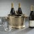 Keep your wine cool and stylish with our Raw Aluminum Three Bottle Wine Holder in Gold. This luxurious ice bucket is the...