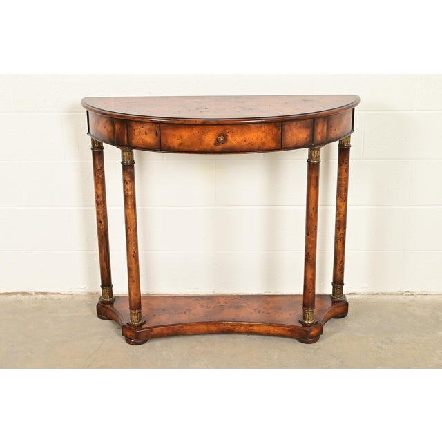 A gorgeous French Empire or Neoclassical style demilune console table In the manner of Maitland Smith USA, Circa Late 20th...