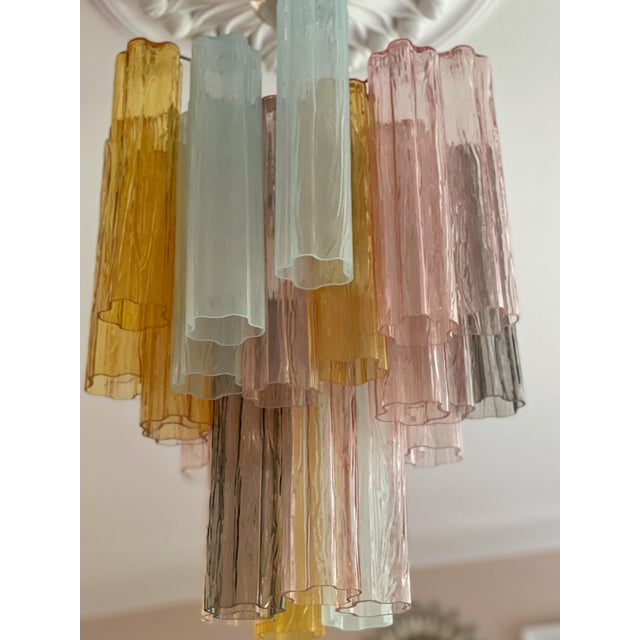 Set of 3 three eclectic murano chandeliers. Tubular formed glass prisms in traditional italian mid-century style, produced...