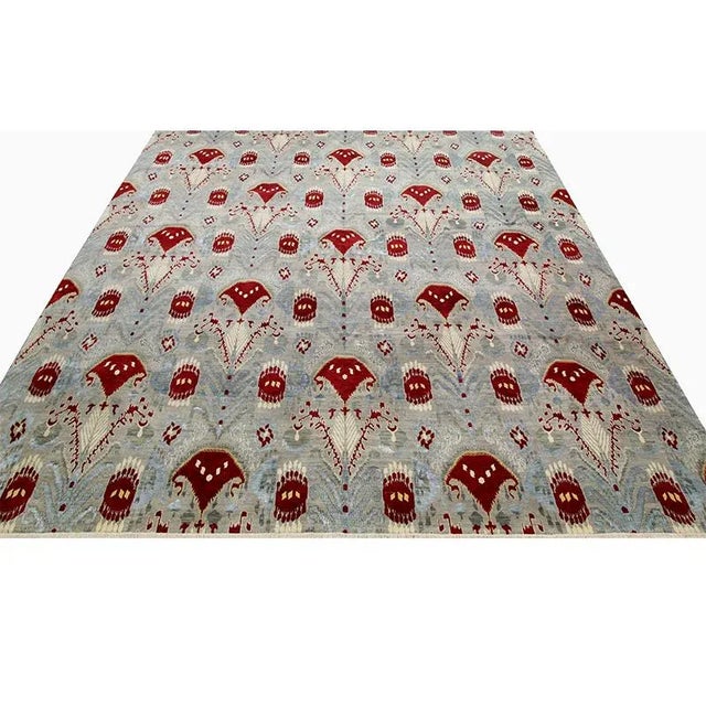 This stunningly beautiful handwoven Ikat area rug is an excellent choice for anyone wanting a striking foundation for...