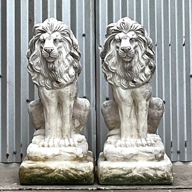 Add a majestic and regal touch to your outdoor space or entryway with this striking pair of vintage cast cement lion...
