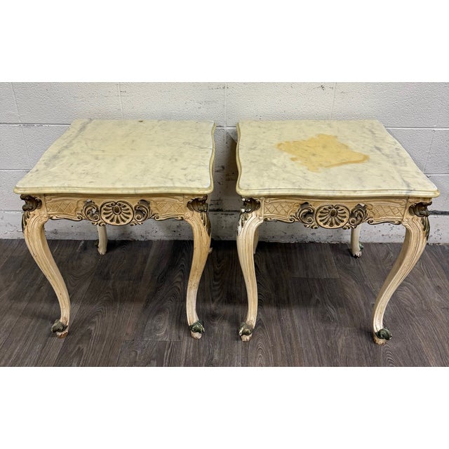 This is a gorgeous pair of vintage Italian Louis XV style marble top end tables with carved painted wood frames, gilt...