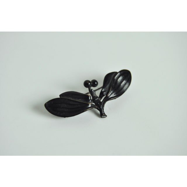 Antique art nouveau brooch in black metal, dragon fly design. Early 1900s. Good vintage condition. Wear consistent with...