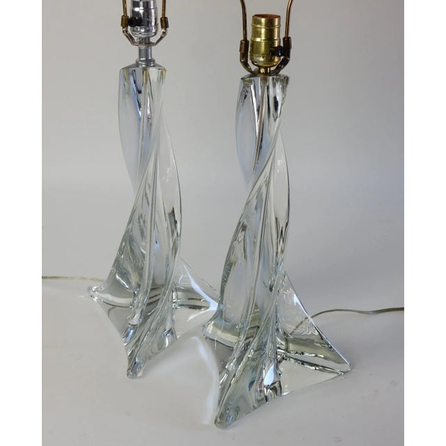 A pair of vintage art glass table lamps by St. Louis Crystal of France. Bespoke crystal glass forms that produce a...