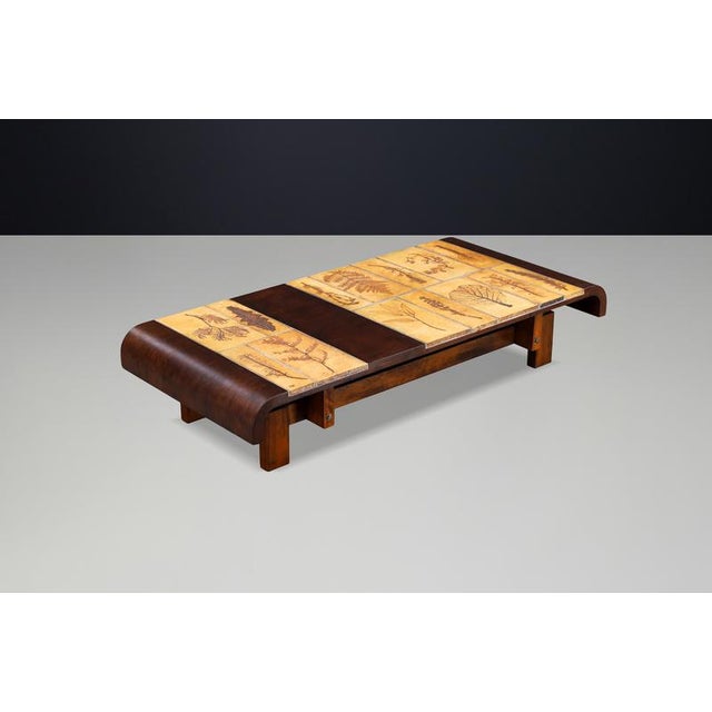Rare Roger Capron coffee table featuring original Garrigue ceramic tiles set in a solid bent beechwood frame with elegant...