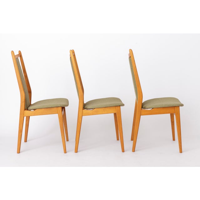 Set of 4 vintage dining chairs crafted from stained beech wood, dating back to the 1960s. Likely manufactured by Casala,...