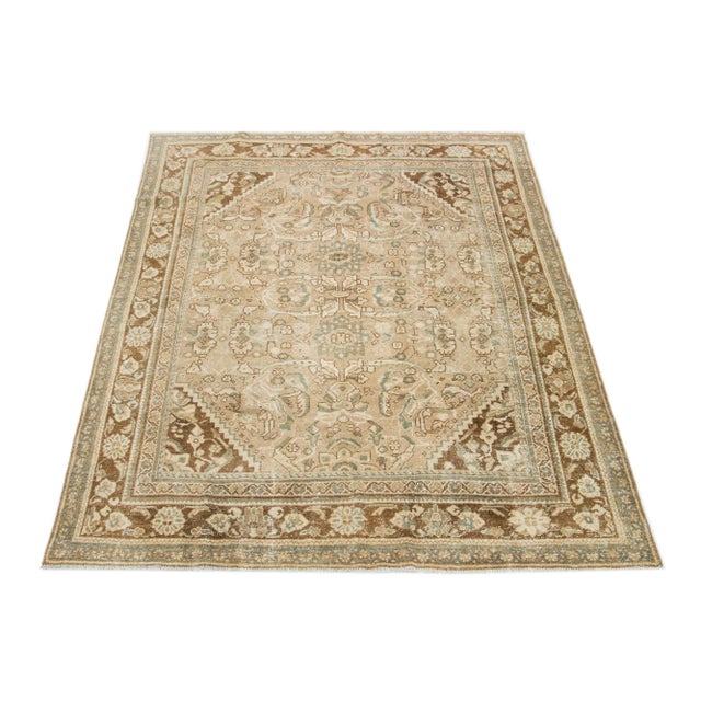 Beautiful Vintage Mahal hand-knotted wool rug with a beige color field. This Persian rug has classic green and brown hues...
