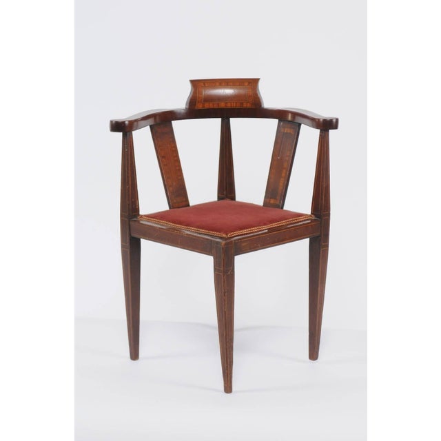 A French mahogany child corner chair with banded inlay from the turn of the century. This exquisite French mahogany corner...