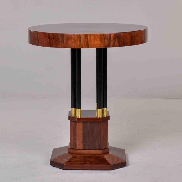 A striking Art Deco occasional table with a round, book-matched mahogany veneer top in a quartered diamond pattern. The...
