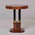 A striking Art Deco occasional table with a round, book-matched mahogany veneer top in a quartered diamond pattern. The...