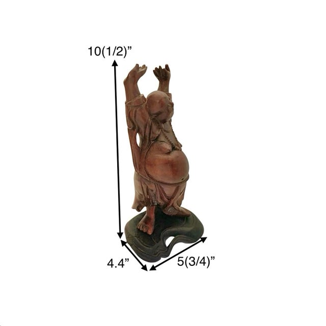 This vintage Buddha sculpture is a beautifully carved piece made of rosewood, with intricate inlaid eyes and teeth adding...