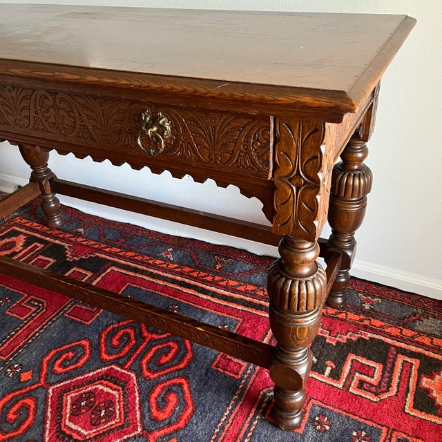 Antique library table by Robert Mitchell Furniture Co. of Cincinnati, Ohio, dating to the early 20th century. This...
