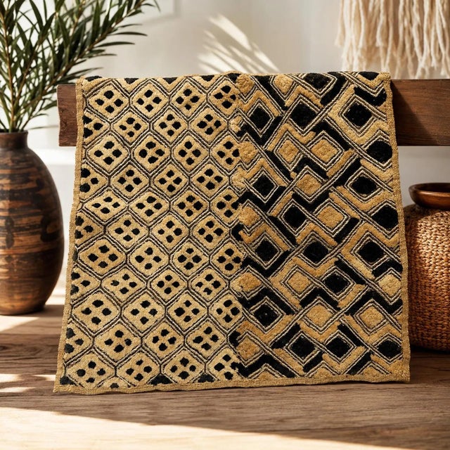 Bring the timeless artistry of Central Africa into your home with this authentic vintage Shoowa Kuba cloth, handwoven from...