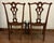 These chairs have all the design elements of classic Chippendale. The splat back features an intricate, open cutout...