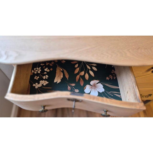 Beautifully restored with respect for its history, this antique solid wood vanity dresser offers timeless craftsmanship...