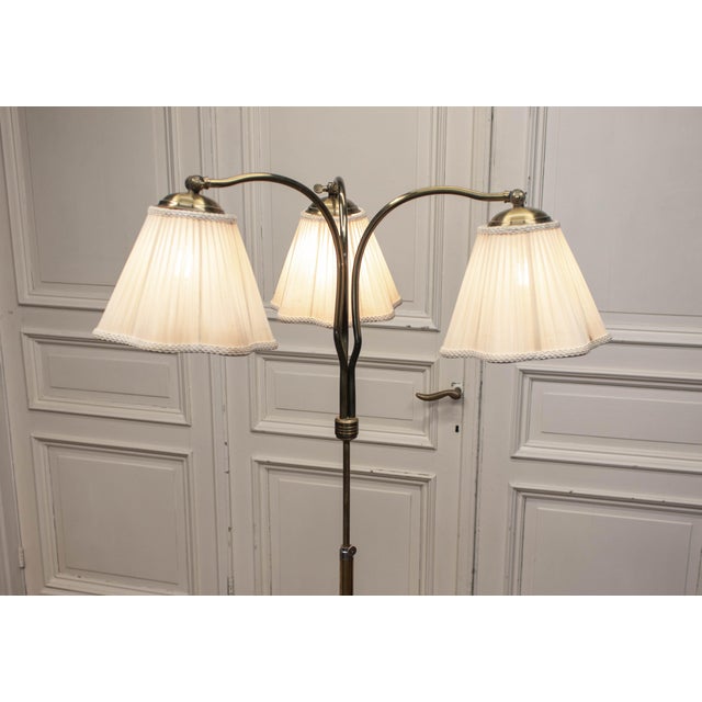 The lamp features a solid elm wood base with chrome accents, a copper central rod, and brass upper fittings. The elegant...
