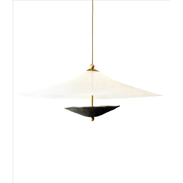Luminara Two forms in conversation, a hand-built ceramic bowl that cradles the light source, sending a warm glow upward...