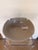 Contemporary ceramic decorative bowl featuring a soft gray finish with a subtle speckled texture and a clean, sculptural...