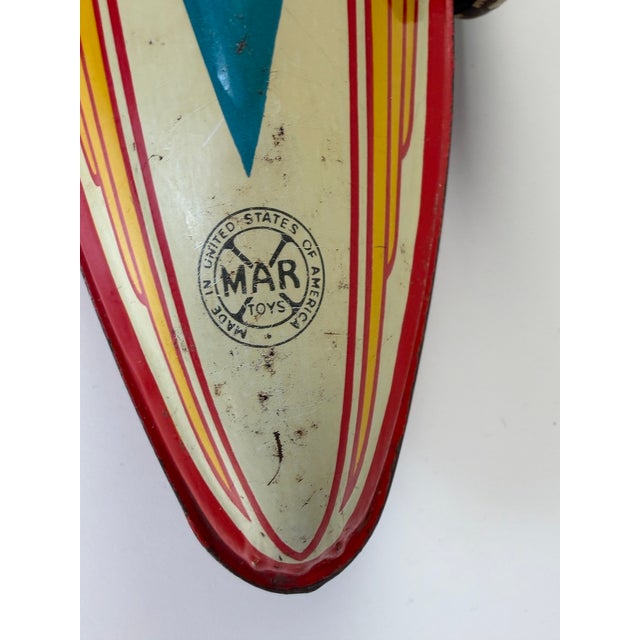 Large and highly decorative collectible boat tail racer by louis marx & co., an impressive american tinplate racing car...