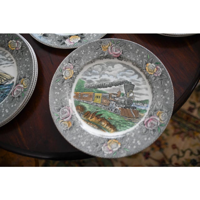 This lovely set of 8 polychrome transferware dinner plates present scenes from across America from the library of Currier...