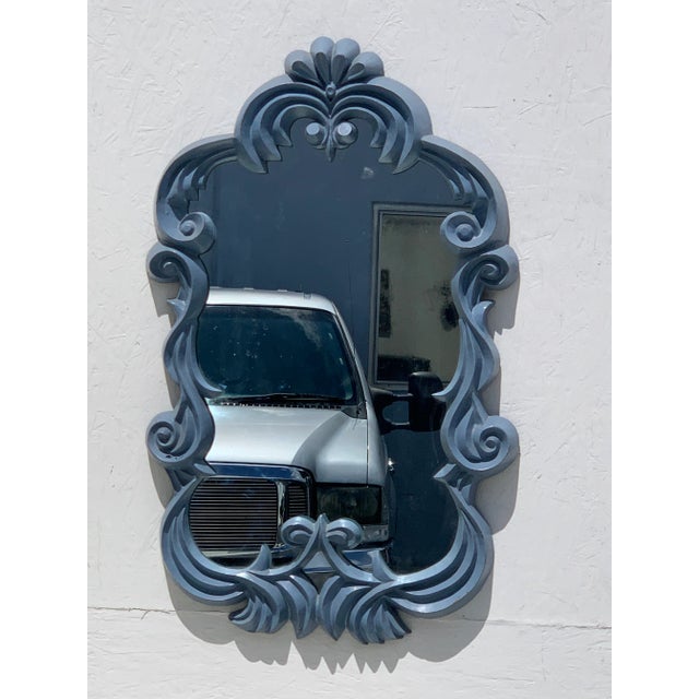 A neat grise mirror in the manner of Serge Roche. Late French Art Deco style Made of fiberglass this highly decorative...