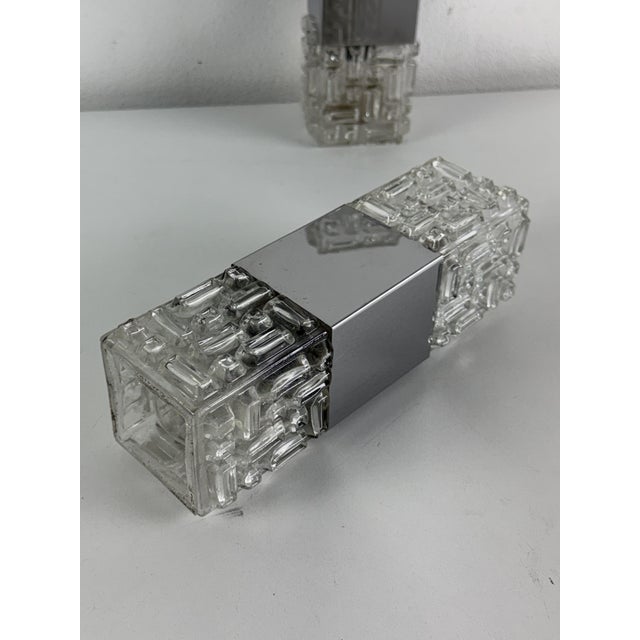 Set of two Space Age wall lamps in the style of Gaetano Sciolari, 1970s Chromed metal, each with two E14 bulbs. Metal and...