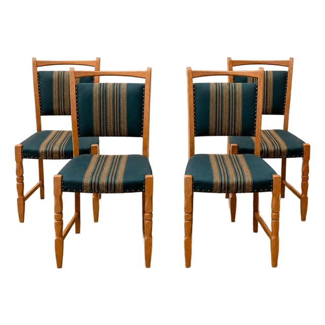 Set of Four Danish Oak Dining Chairs in the Style of Henning Kjærnulf, Denmark, Circa 1970s For Sale