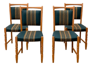 Set of Four Danish Oak Dining Chairs in the Style of Henning Kjærnulf, Denmark, Circa 1970s