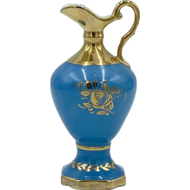 Details: -Urn is beautiful blue with gold detail and features a charming floral motif -Approx. Dimensions: 6.25"H x 2.5"W...