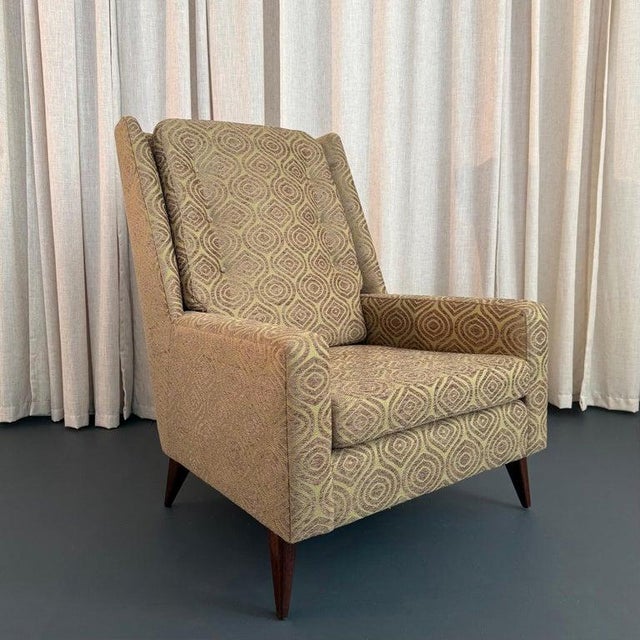 This fabulous Mid-Century Modern lounge chair is cozy and enveloping with an abundance of style and fine detailing. The...