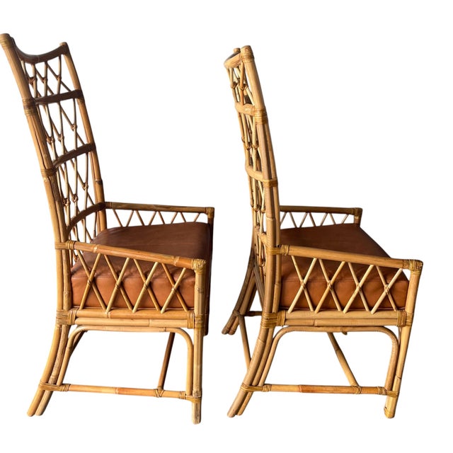 Pair of Palecek Rattan Bamboo Dining Chairs with Leather Cushions Elevate your space with this stunning pair of Palecek...