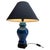 Inspired by a centuries-old technique of Chinese ceramics, this elegant table lamp is a bright and dramatic shade of...