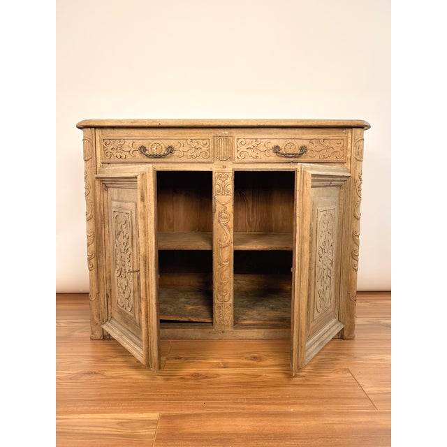 19th Century Louis XIV style walnut sideboard featuring intricate hand-carved rose details. Compact yet functional, it...
