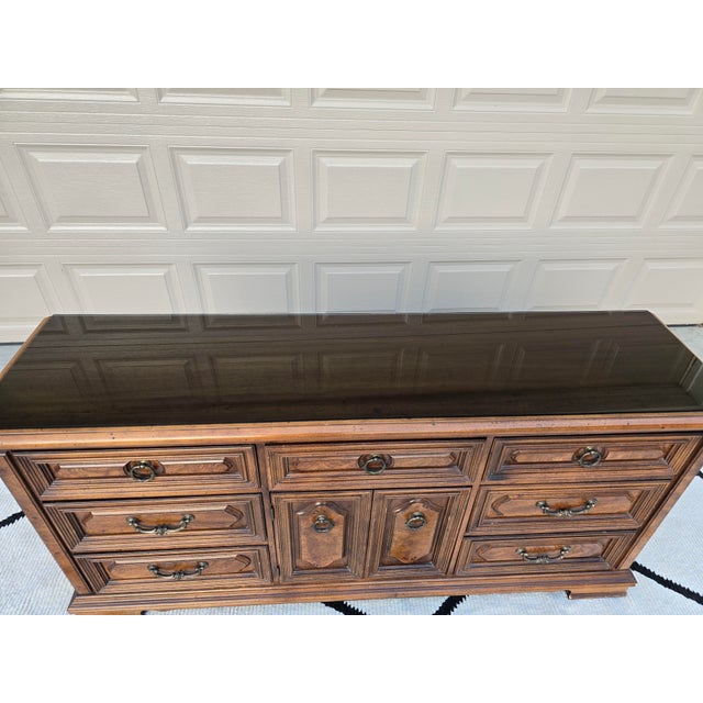Beautiful, high-quality vintage wood dresser featuring a traditional, ornate design with stunning geometric wood paneling....