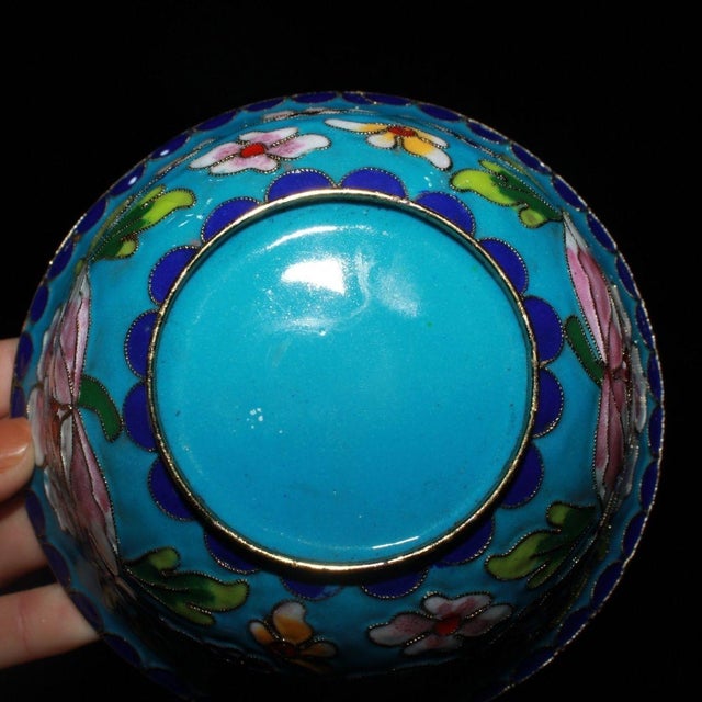 This exquisite Chinese Cloisonné enamel tea bowl is a stunning example of traditional craftsmanship. The piece features a...