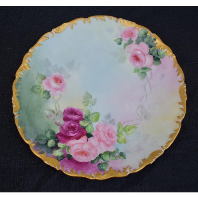 Antique : Early 20th Century Round Decorative Plate with Scalloped Edge and hand Painted Roses and a Gold Gilt Rim. Made...