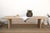 At ten feet long, the Béarn is built for a room that actually entertains. Two solid panel pedestal legs carry the full...