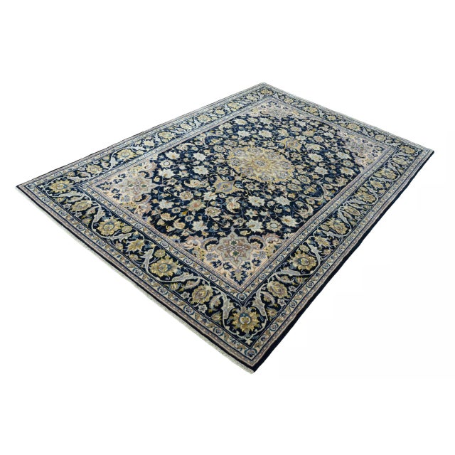 This impressive hand-knotted Kashan oriental rug impresses with its generous dimensions of 320 x 220 cm and its classic...