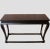 This console is decorated with muted antique black finish with reddish hue, patina and distressed edges and top. With...